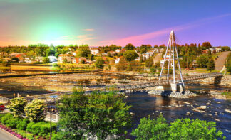 Colorful Pedestrian River Cross Footbridge in Saguenay